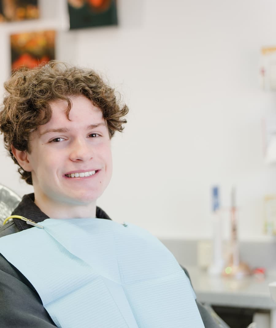 Young patient smiling in the dental chair at Dalkeith Dental