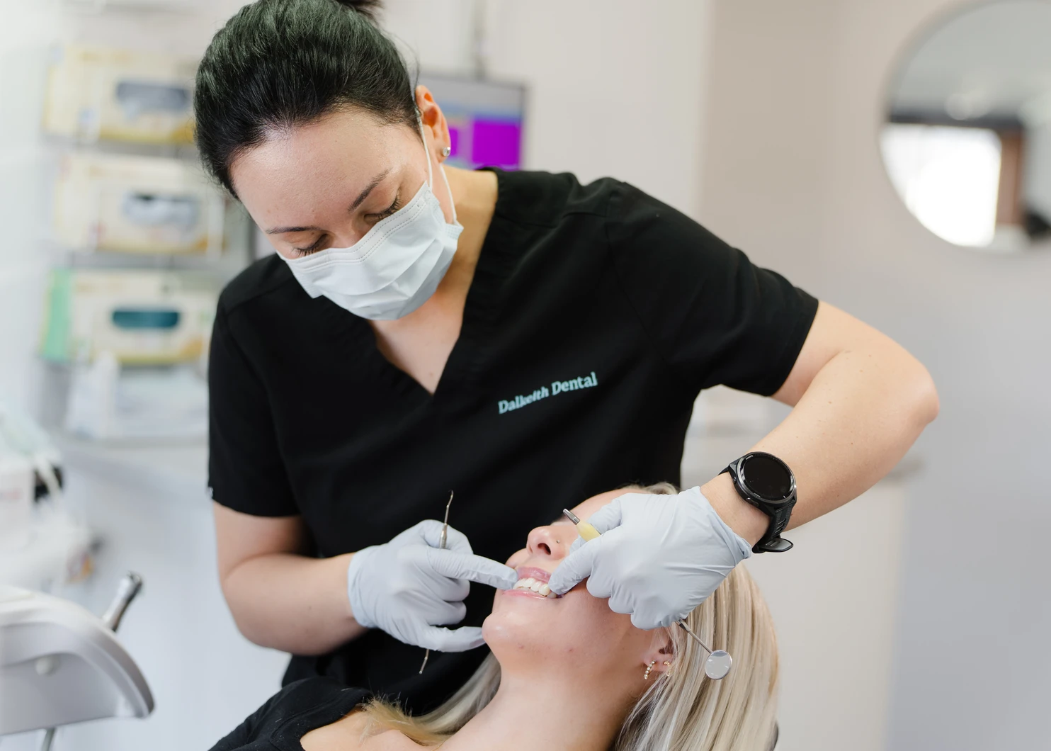Dalkeith Dental clinician checking a patient's teeth during cosmetic dental care
