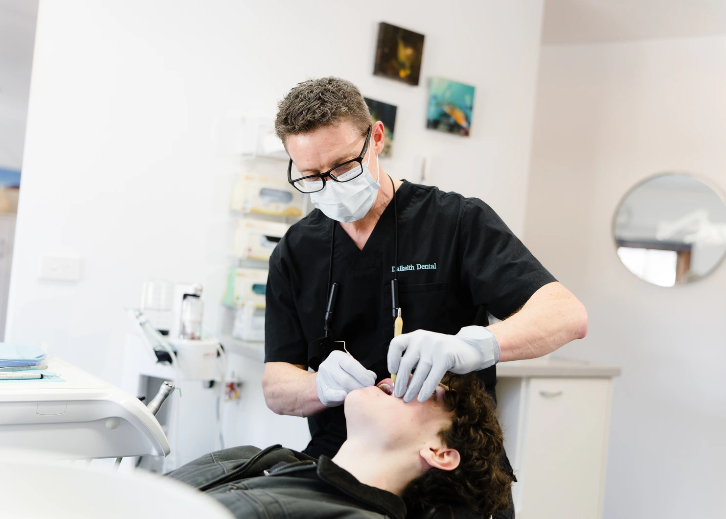Dalkeith Dental clinician examining a patient during a dental check-up