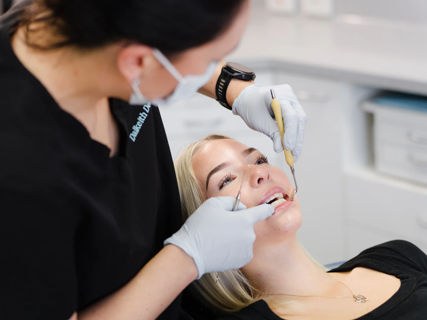 Dalkeith Dental clinician carrying out careful tooth repair work