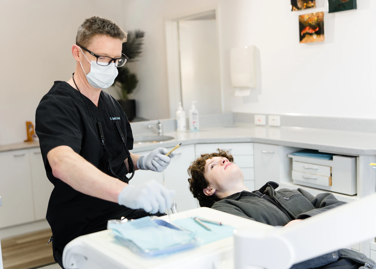 Dalkeith Dental clinician assessing a patient in the dental chair