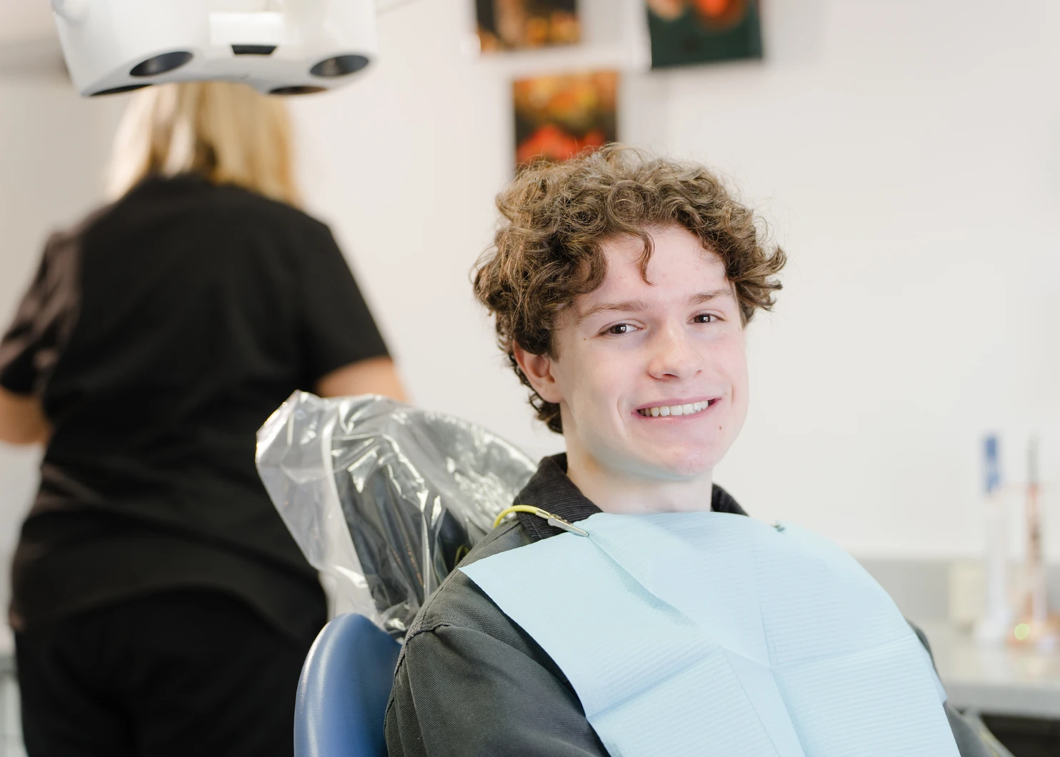 Teen patient smiling in a dental chair at Dalkeith Dental