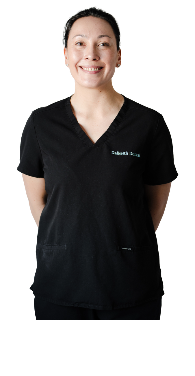 Dr Rachael Pantin smiling with folded arms in a white dental coat
